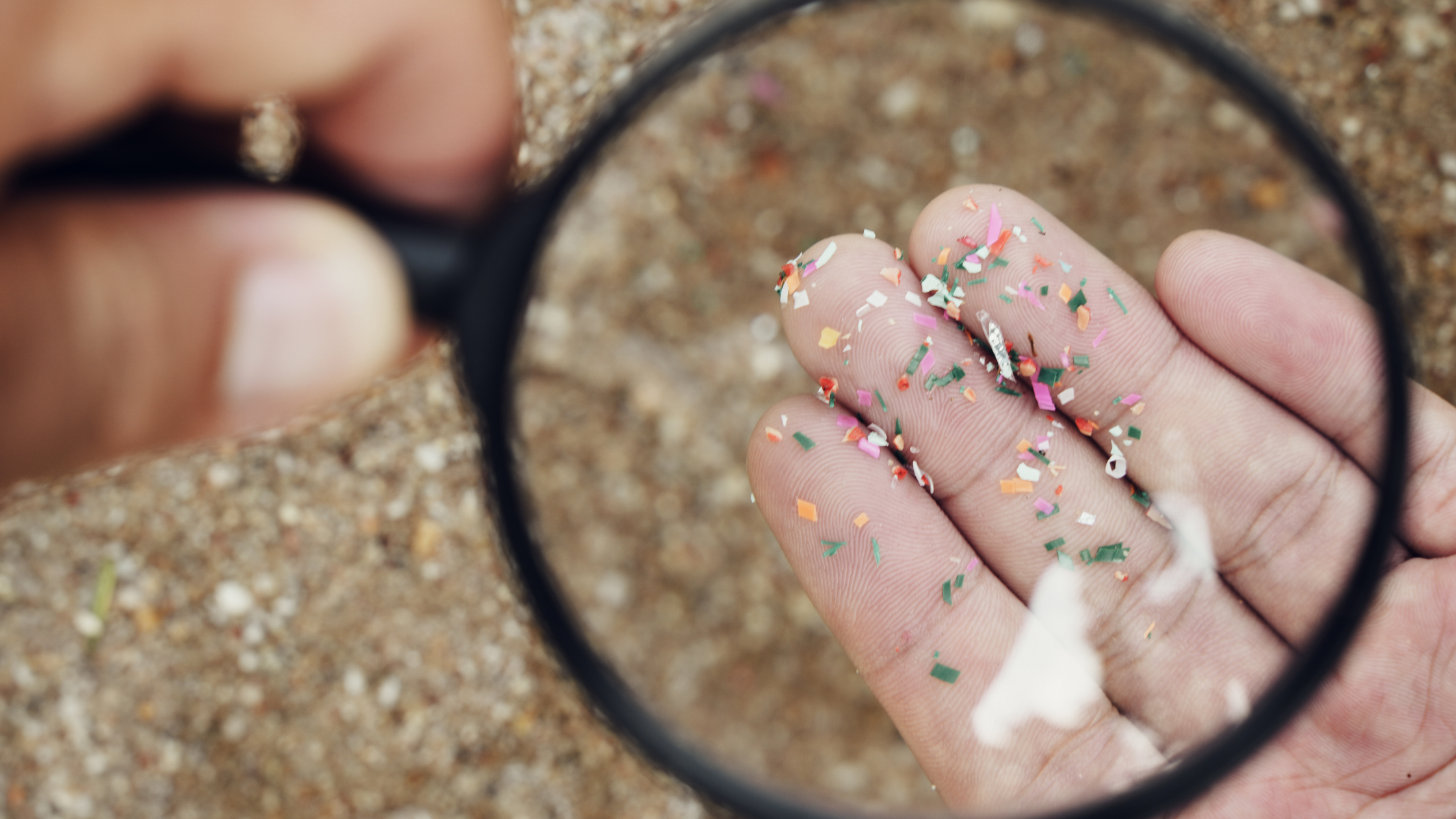 image of microplastics under a magnifying glass